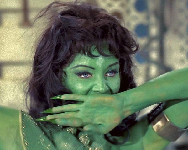 Susan Oliver as Vina, as an Orion Slave woman - a woman with vivid green skin and black hair; wearing an outfit that's only visible as a band of green and shimmery gold fabric across her rig